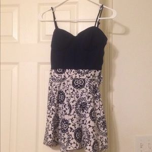 Blue and white romper with designs